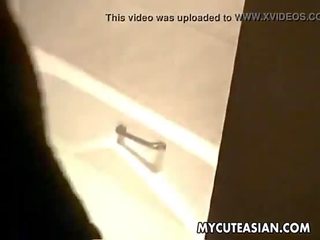 Beautiful Asian teen uses her huge blue dildo to fuck her wet punani